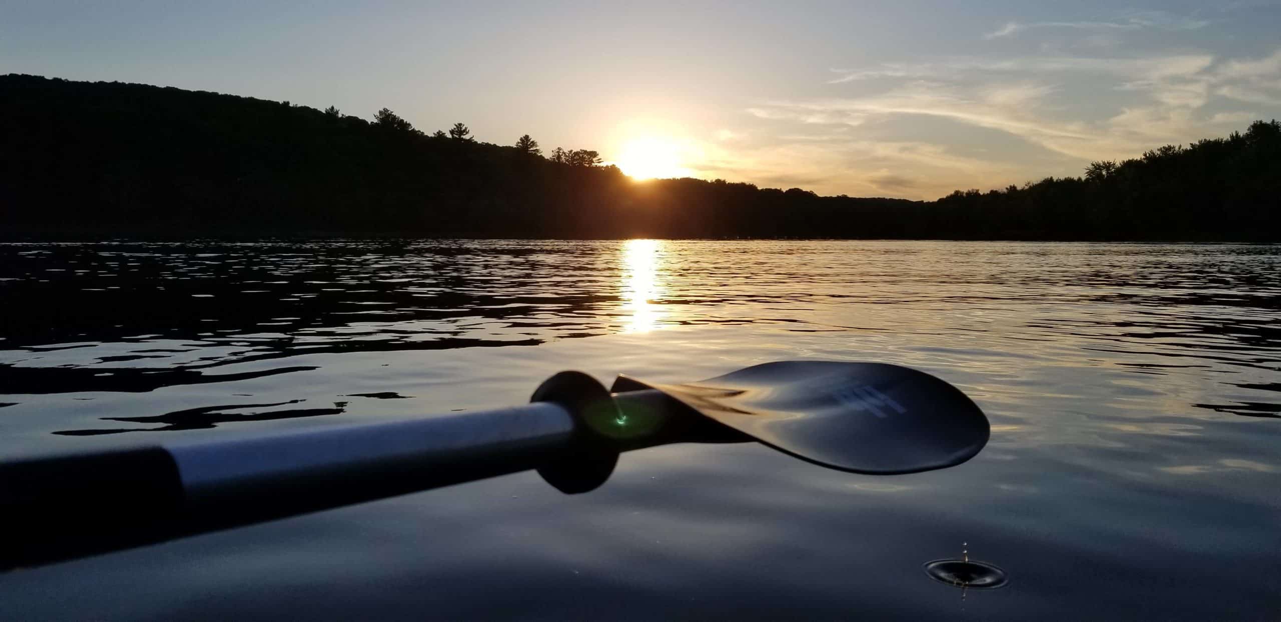 Kayak paddle sunset drop of water