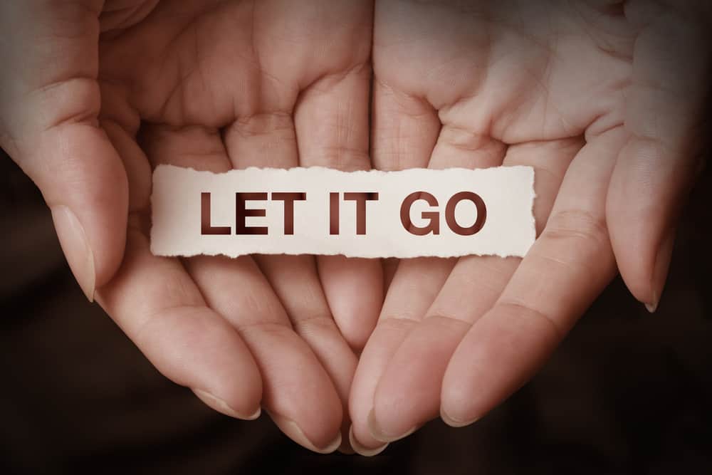 Let it go text on hand design concept